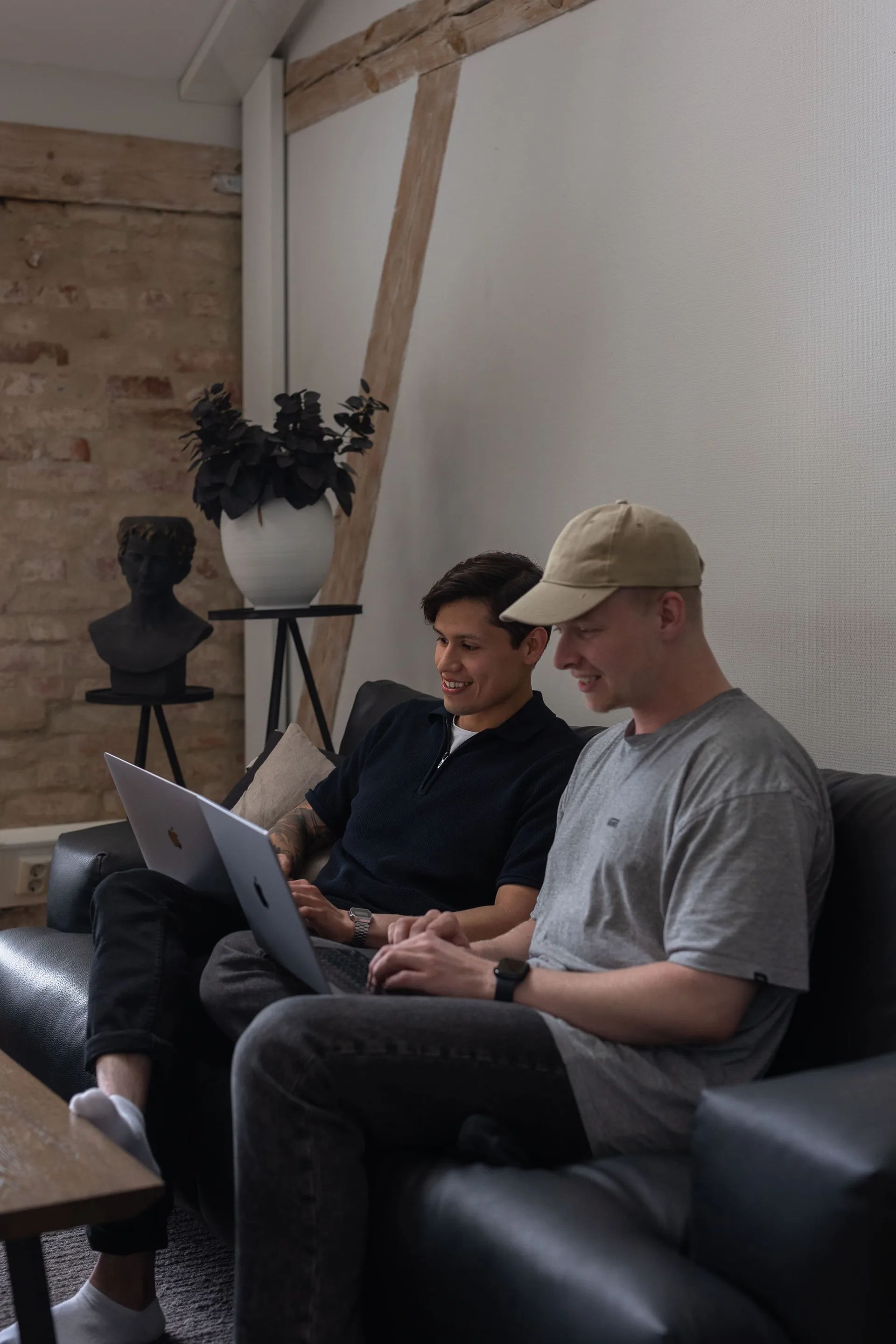 Two colleagues pair programming in front of a screen