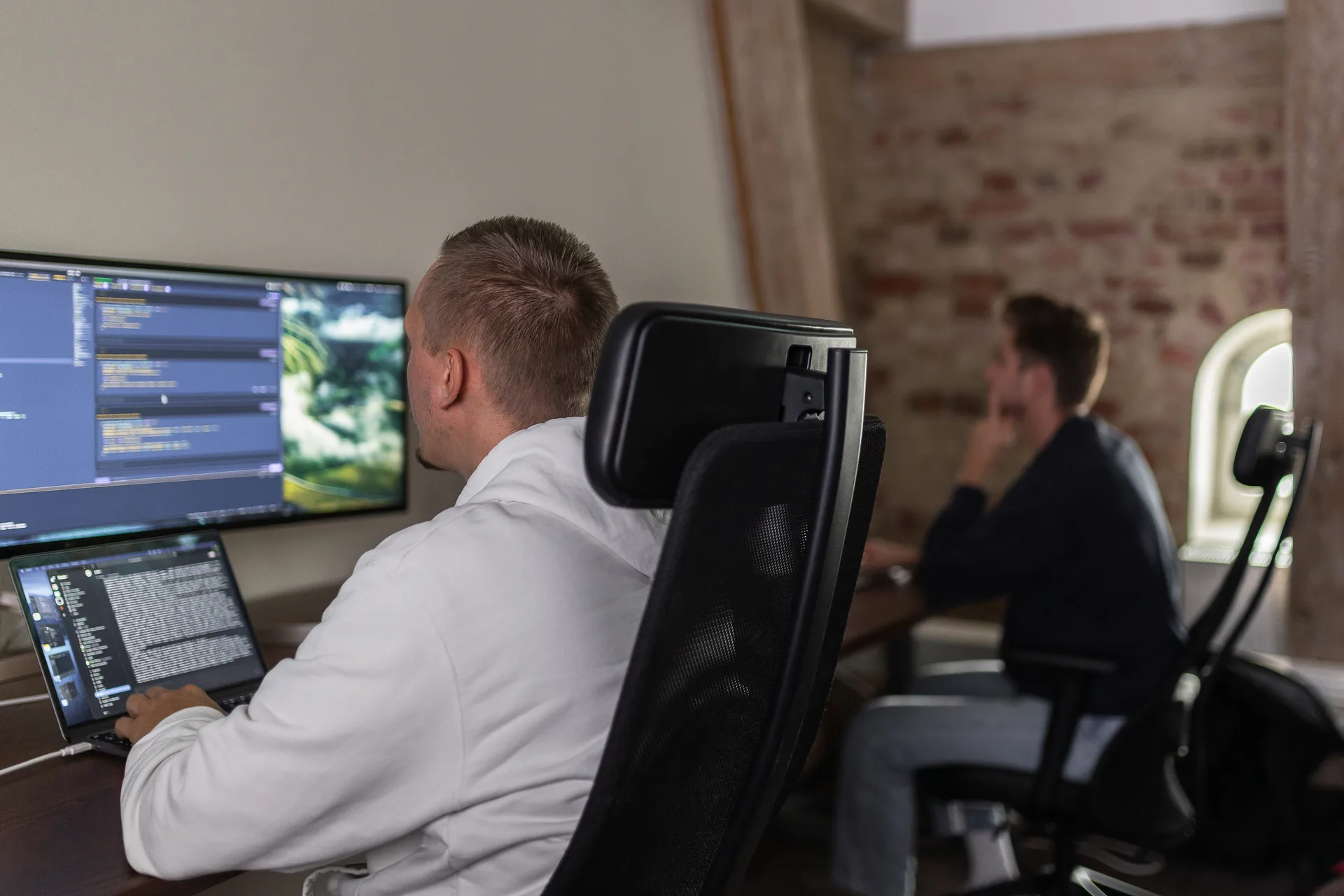 A Flowbic developer working at their screen in the office
